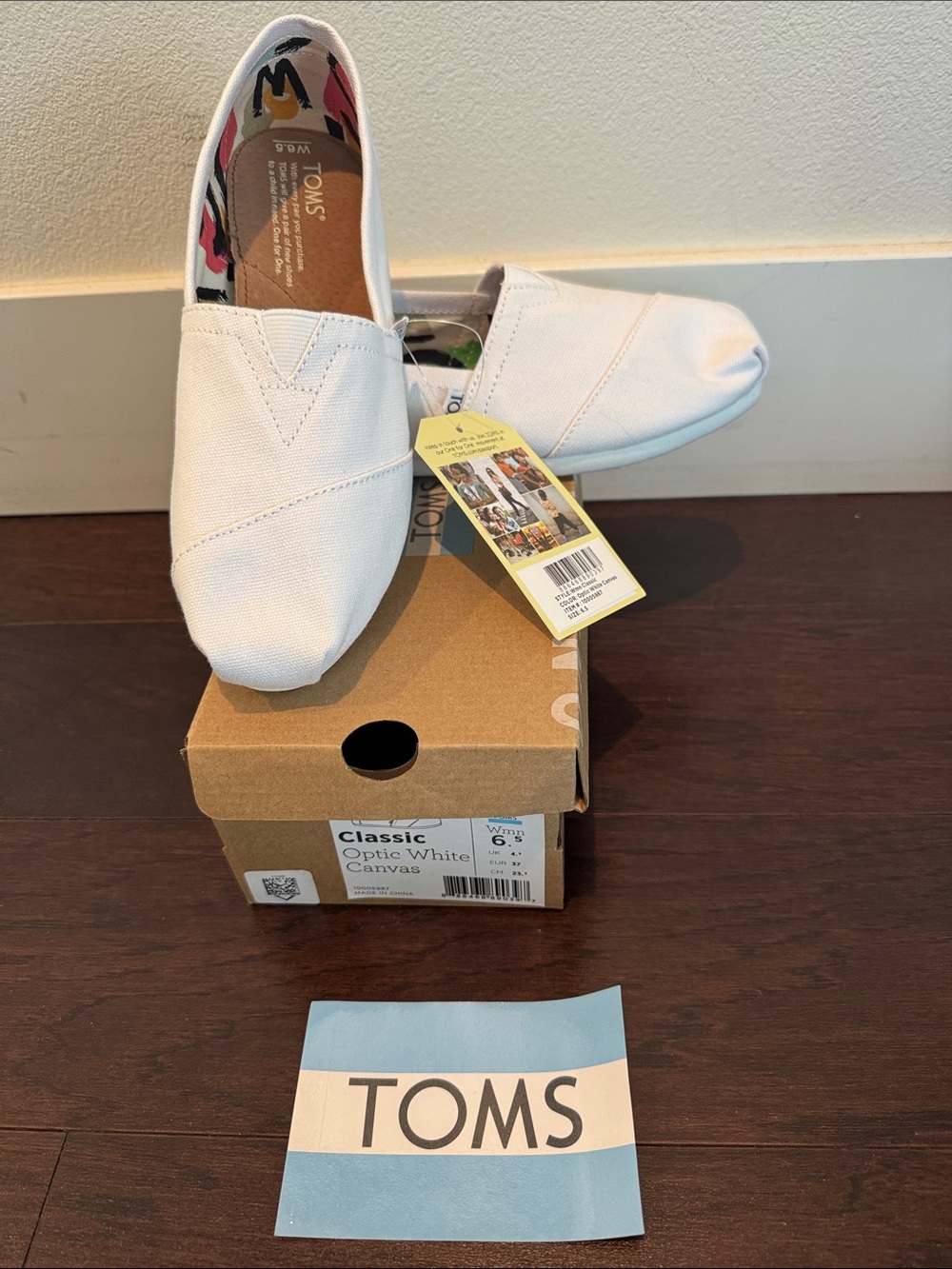 TOMS Classic Slip-On Canvas Shoes in Optic White with Multicolor Lining